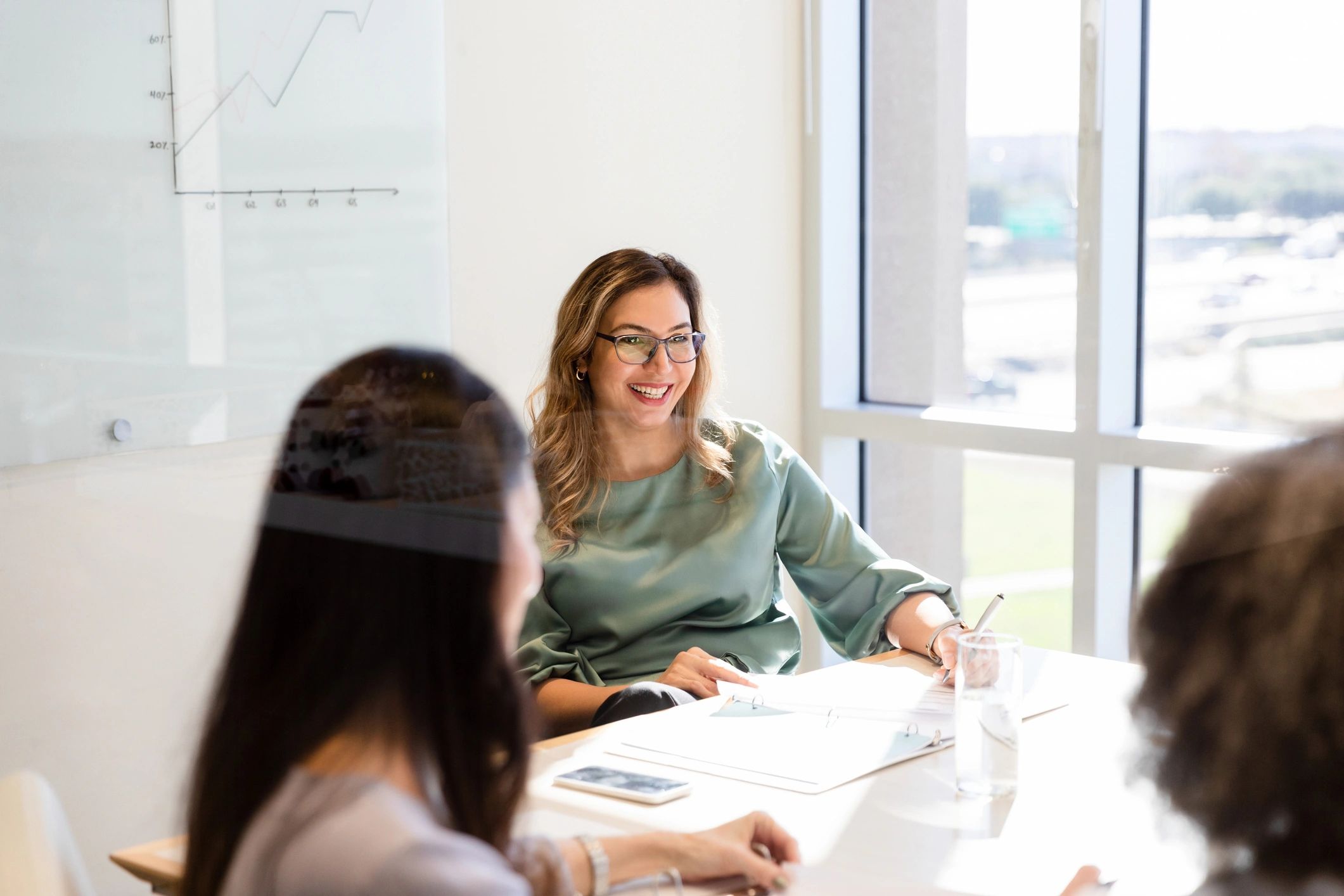 Consultant speaking during a team meeting